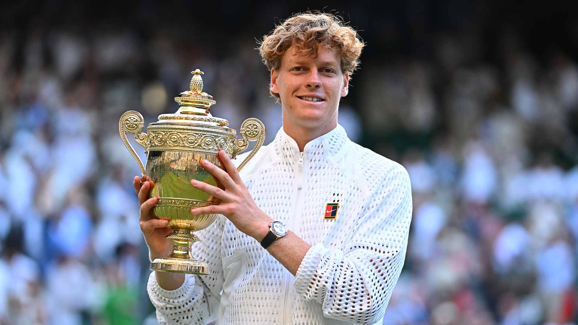Jannik Sinner holds the Wimbledon trophy on Centre Court